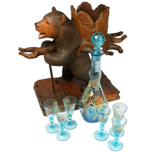 Load image into Gallery viewer, Antique Black Forest Carved Wood Bear Liquor Caddy Tantalus Enameled Blue Glass Decanter & Cordials Set