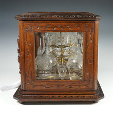 Load image into Gallery viewer, Antique Black Forest Liquor Tantalus Carved Wood Cabinet Box Caddy Victorian Engraved Crystal Decanters & Cordial Glasses