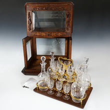 Load image into Gallery viewer, Antique Black Forest Liquor Tantalus Carved Wood Cabinet Box Caddy Victorian Engraved Crystal Decanters & Cordial Glasses